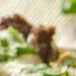 Tostada de bistec con queso