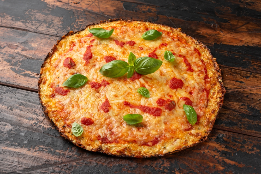 Cauliflower,Crust,Pizza,With,Tomato,Sauce,,Cheese,And,Basil.,Healthy