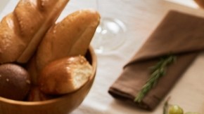 Multiethnic,Group,Of,People,At,Festive,Dinner,Table,Celebrating,Thanksgiving