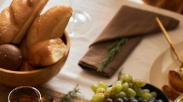 Multiethnic,Group,Of,People,At,Festive,Dinner,Table,Celebrating,Thanksgiving